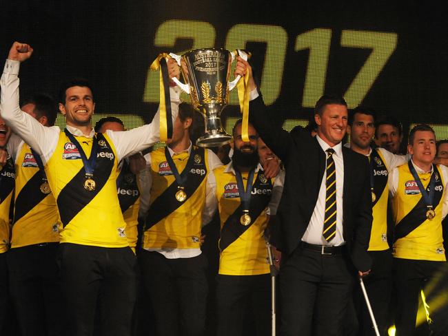 Richmond players hold the cup aloft at their celebration party. Picture: Andrew Henshaw