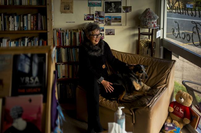 Linda Sang with her dog Ed at Well Thumbed Books in Cobargo, NSW. Linda and a few other local Cobargo residents started the bookshop ten years ago, which also acts as a meeting place for local community interest groups as well as the local newspaper The Triangle. Picture by Sean Davey.