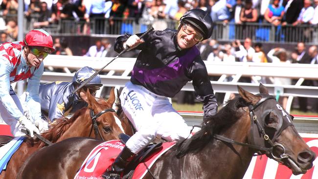 Damien Oliver wins the 2013 Melbourne Cup on Fiorente for Gai Waterhouse. Picture: Wayne Ludbey.