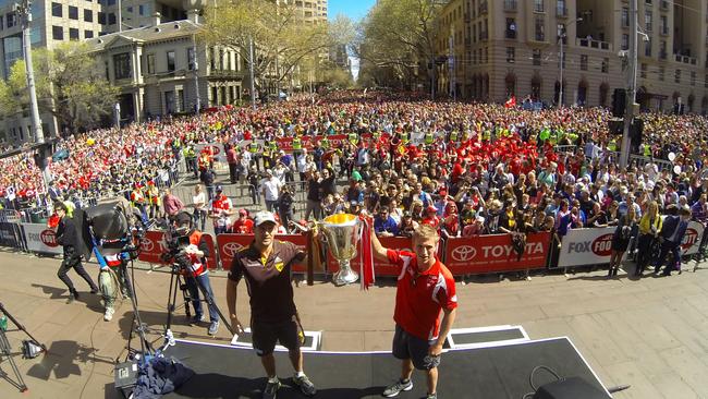 2014 AFL Grand Final Parade. Luke Hodge and Keiran Jack hold the premiership cup aloft on the steps of Parliament. Pic: Michael Klein