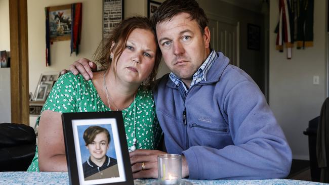 Kristy and Brad Coad, with a picture of their son Josh. Picture: Zak Simmonds