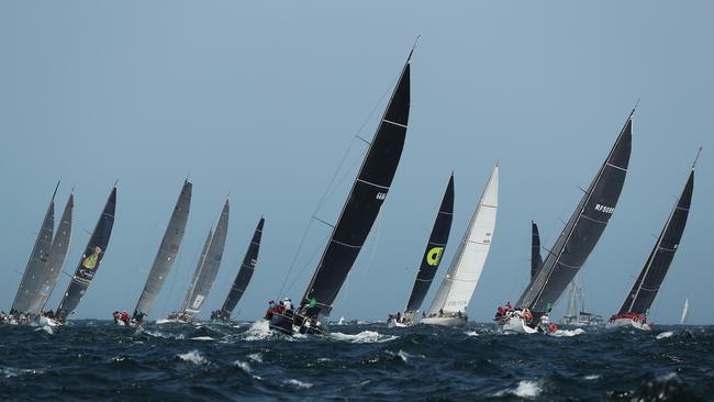 Yachts leave Sydney Harbour during the start of the 2019 Sydney Hobart Yacht Race. Picture: Brett Costello