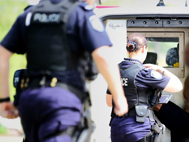 Police arrest a man in relation to an alleged stolen vehicle. A Toyota LandCruiser was dumped near Lappin Park, Kirwan.  Picture: Alix Sweeney