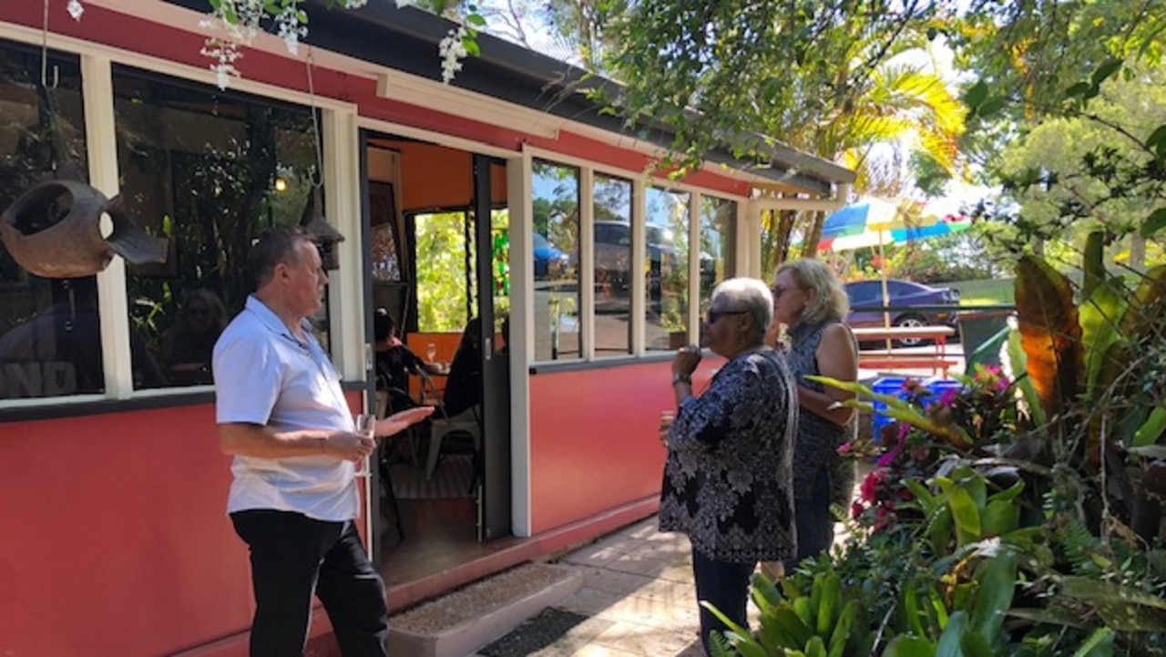 Paul Halliday, with Lynley Halliday with friends, officially opened the Bulumba-Our Land exhibition at the Frond Café/Gallery, Lake Eacham Tourist Park.