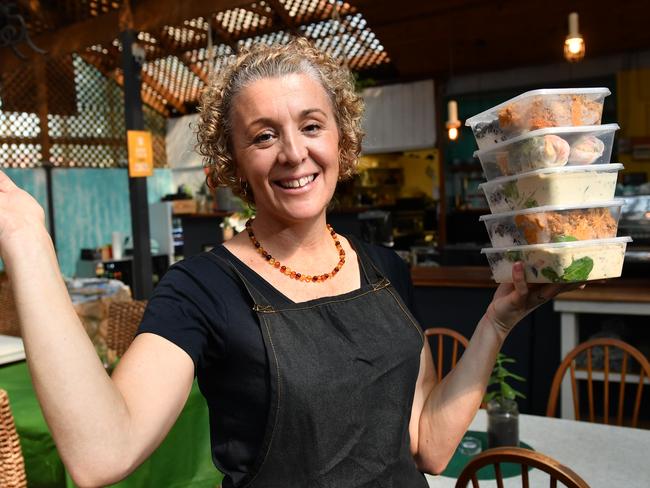 The Fleurieu Pantry owner Trudy Fischer poses for a photograph at the Port Noarlunga cafe, Adelaide on Friday the 20th of March 2020. She is offering a handy food service for those suffering COVID-19 by preparing home cooked meals and leaving them outside the shop for people to collect. She is also calling on the eldery who can't get hold of essential items to get in contact with her so she can help. (AAP/ Keryn Stevens)