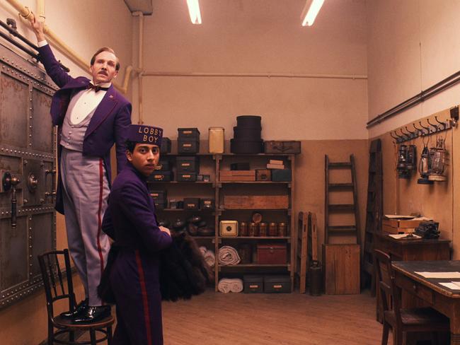 Quirky hit ... Ralph Fiennes, left, and Tony Revolori in "The Grand Budapest Hotel”, nominated for best comedy and best screenplay. Pictur: AP Photo/Fox Searchlight