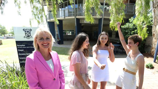 Principal of St Aidan's Corinda Toni Riordan with students Alice Baumann, Genevieve Rule and Phoebe McAuliffe who have just received their OP scores. Picture: Richard Waugh/AAP 