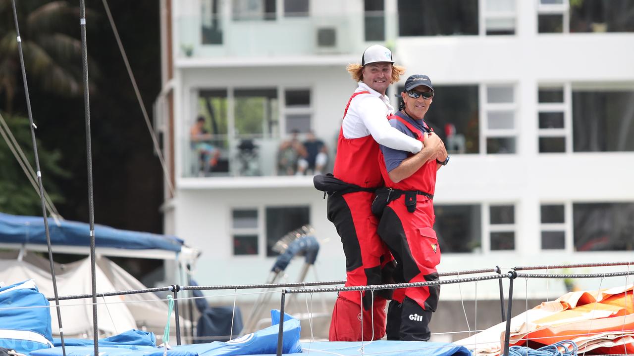 Excited crew members on board a yacht as is leaves for the start. d