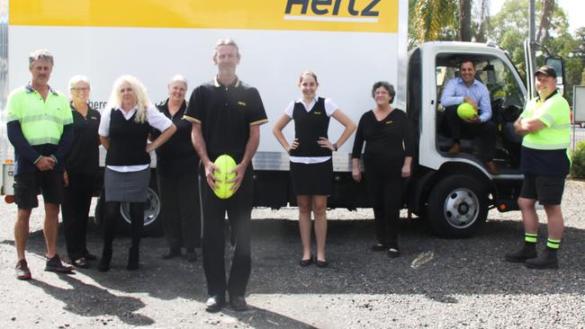 TEAM BEHIND THE TEAM: At Hertz Northern Rivers, employees including Lismore Swans AFC senior men's team coach Ashley Prichard (centre) said colleagues (L-R) Neil Jeffs, Judy Croker, Melanie Chambers, Madison Pethers, Julie Butler, Nathan Box and Christian War, are the "team behind the team" supporting local sporting clubs. Photo: Alison Paterson