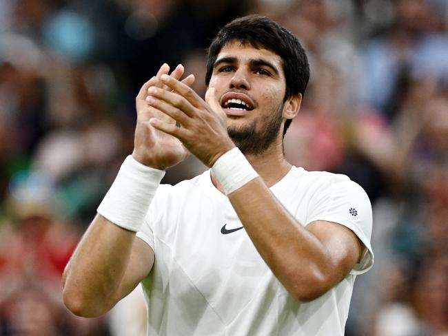 LONDON, ENGLAND - JULY 10: Carlos Alcaraz of Spain acknowledges the crowd following victory against Matteo Berrettini of Italy in the Men's Singles fourth round match during day eight of The Championships Wimbledon 2023 at All England Lawn Tennis and Croquet Club on July 10, 2023 in London, England. (Photo by Mike Hewitt/Getty Images)