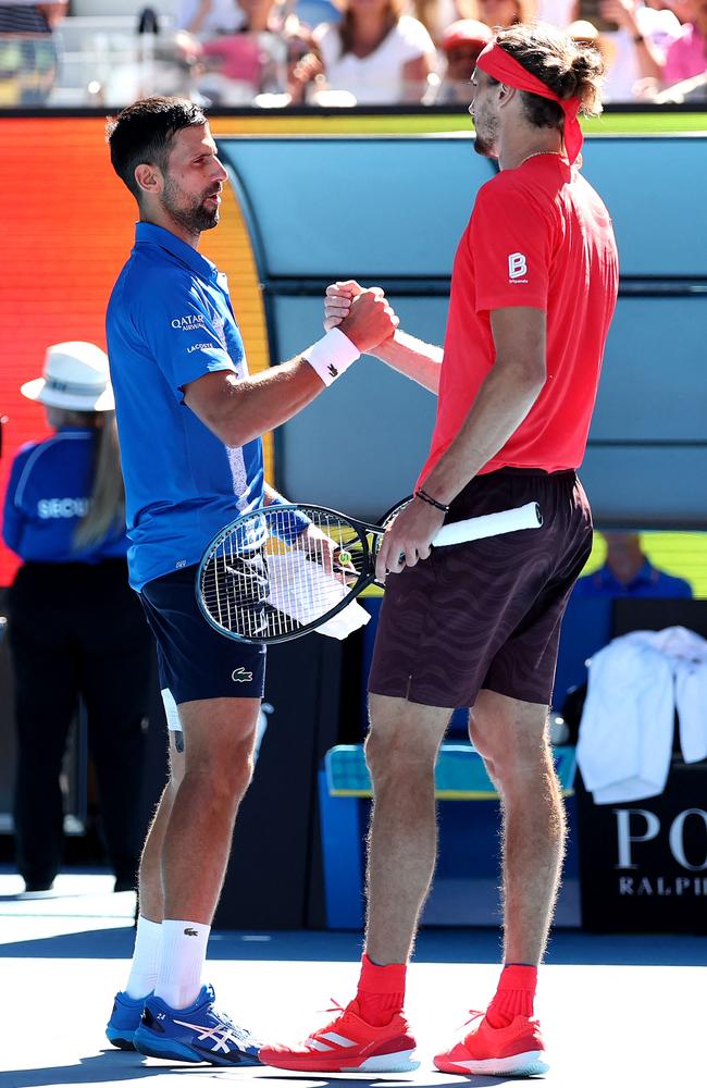 Novak Djokovic shakes hands with Alexander Zverev after the Serbian withdrew from the tournament. Picture: Martin Keep / AFP