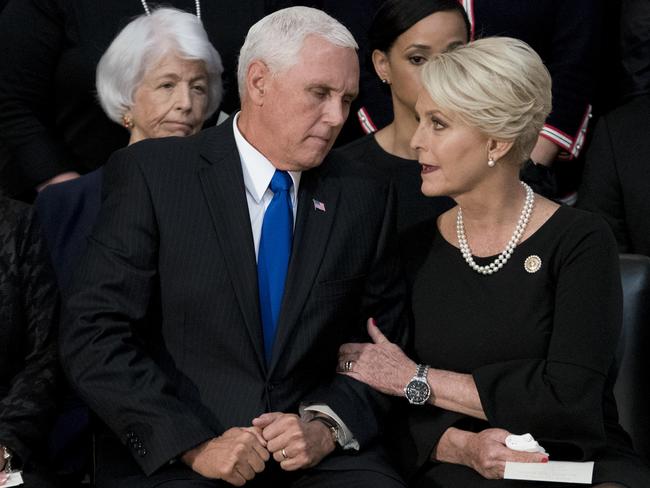 Mike Pence with Cindy McCain at a memorial for her late husband, John, last week, will stand in for Donald Trump at both summits. Picture: AP