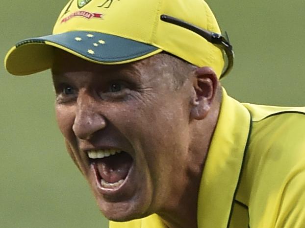 Australia's wicketkeeper Brad Haddin slides along the ground after catching out England's Jos Buttler during their Cricket World Cup pool A match in Melbourne, Australia, Saturday, Feb. 14, 2015. (AP Photo/Theo Karanikos)