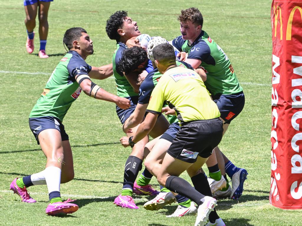 Canberra's defence scrambles to make a tackle. Picture: Martin Ollman