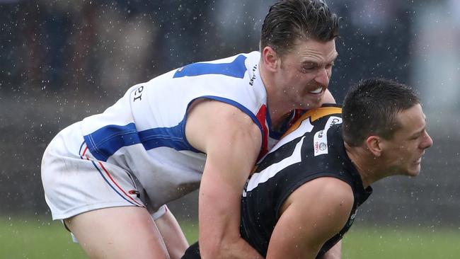 Jackson Clarke of WPL tackles Christian Buykx-Smith of Heid during the NFL Football Div 1 match between West Preston-Lakeside and Heidelberg played at Preston City Oval on Sunday 8th September, 2019.