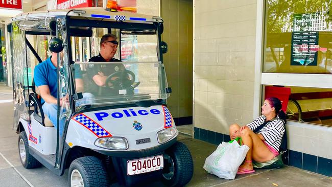 Officer in charge of the Cairns City Police Beat Inspector Gary Hunter talks with a woman on Lake St in the Cairns CBD. Picture: Peter Carruthers