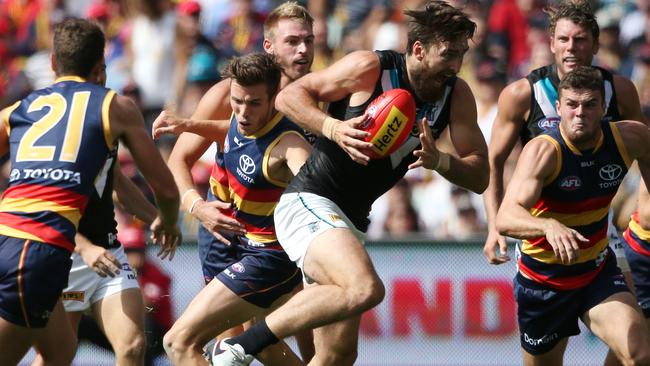 Charlie Dixon evades the Crows for one of only a few times on Saturday. Picture: Ben Macmahon (AAP)