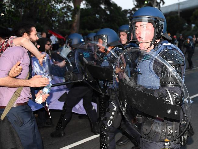 Police in riot gear cordon off protesters outside Milo Yiannopoulos’s show in Melbourne. Picture: Jake Nowakowski