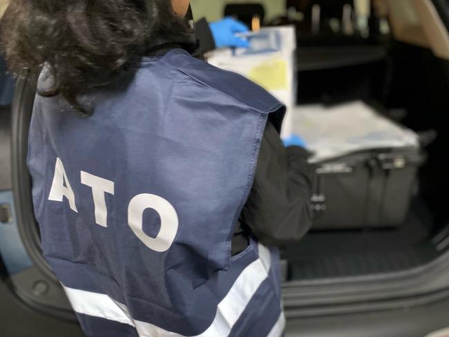 Australian Taxation Office investigators conducting raids on six individuals in Adelaide in connection with the Operation Protego GST refund scam. Pics - ATO