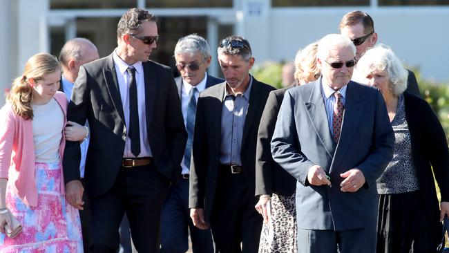 Aaron Cockman leaves Bunbury Crematorium with family and friends after the funerals of his ex-wife Katrina Miles and their children. Picture: AAP /Richard Wainwright.