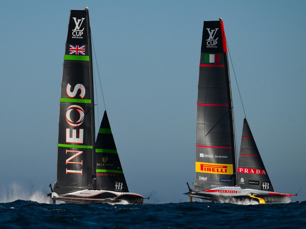 BARCELONA, SPAIN - SEPTEMBER 26: The AC75 Luna Rossa Prada Pirelli Team and the AC75 Ineos Britannia compete during the Louis Vuitton Cup Final Race 1 on September 26, 2024 in Barcelona, Spain. (Photo by David Ramos/Getty Images)