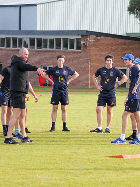 John Hastings helping out at training.