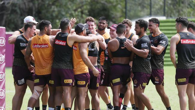 Darius Boyd’s teammates rush him during his final training session. Picture: Picture: Annette Dew