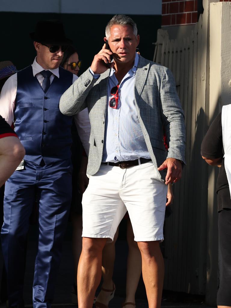 Punters leave Eagle Farm racecourse on Melbourne Cup Day.