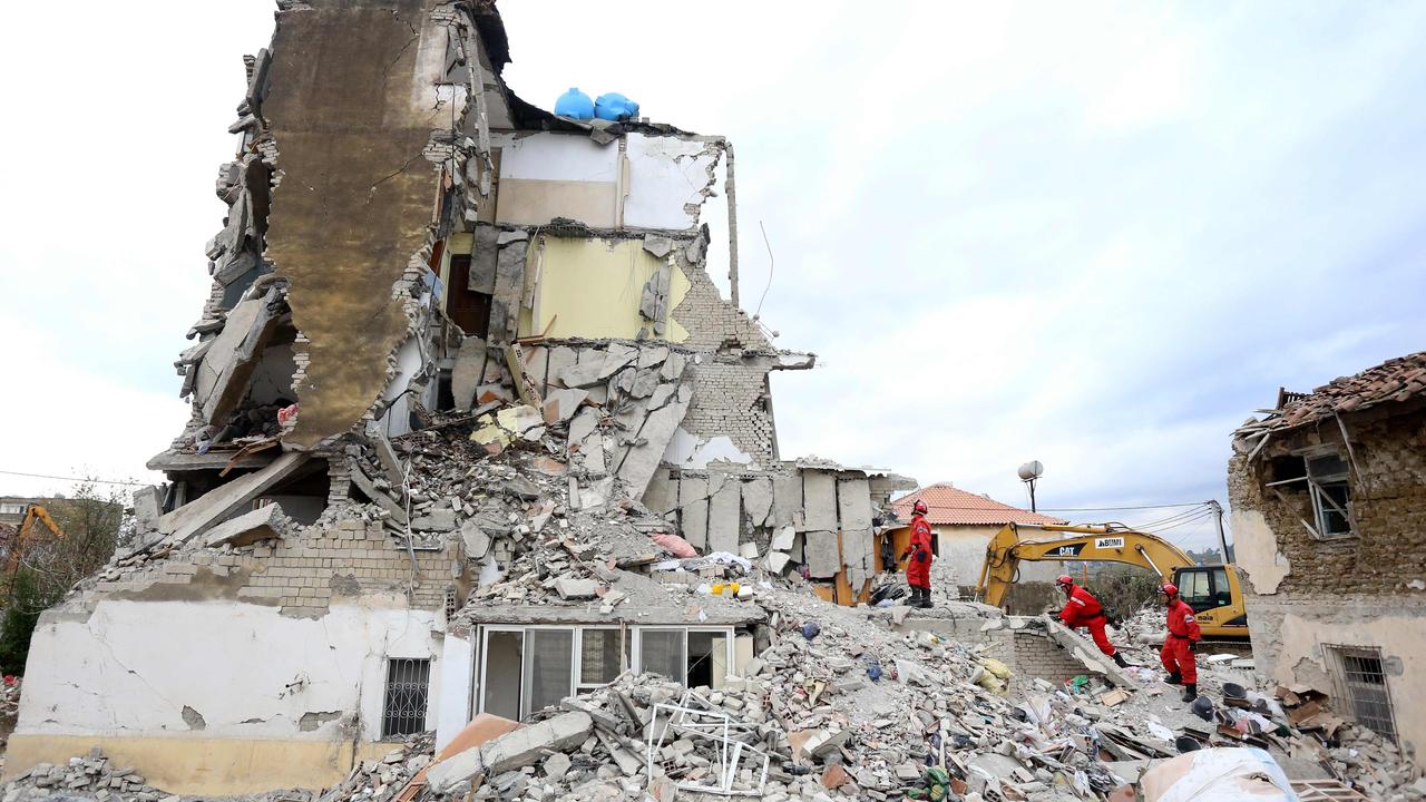 Emergency workers continued to pull bodies from the ruins of buildings gutted by a violent earthquake. Picture: Gent Shkullaku/AFP