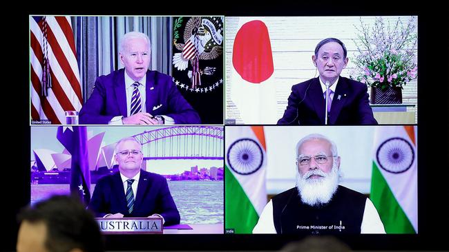 A monitor displaying the virtual meeting of US President Joe Biden (top L), Australia's Prime Minister Scott Morrison (bottom L), Japan's Prime Minister Yoshihide Suga (top R) and India's Prime Minister Narendra Modi. Picture: AFP