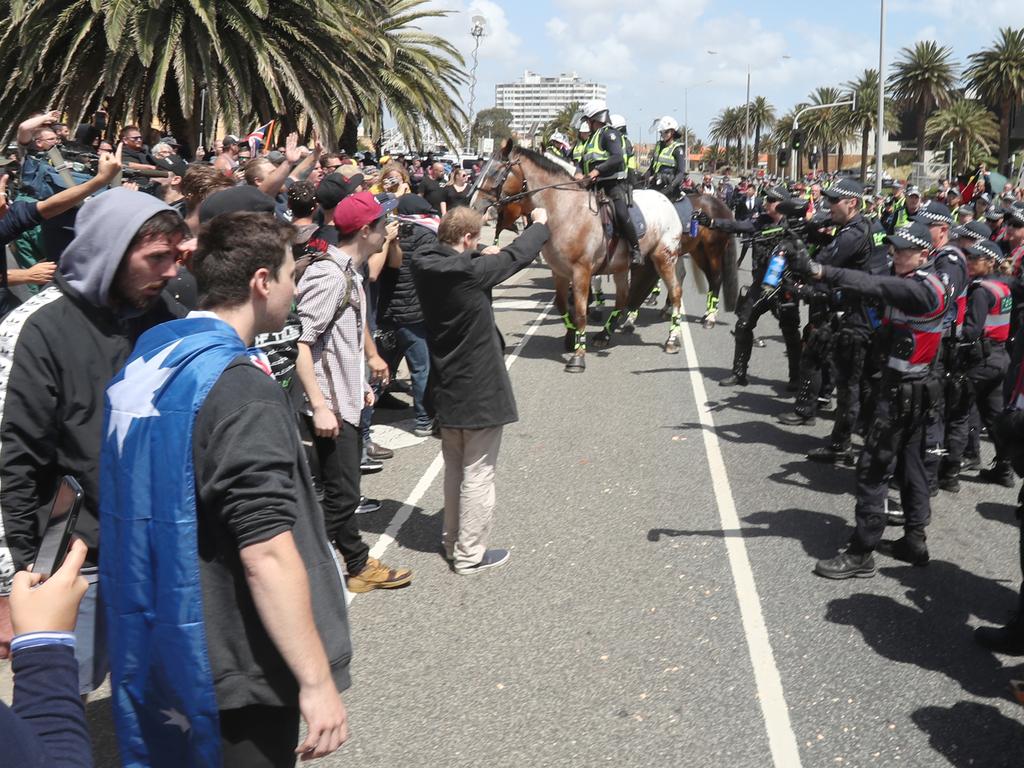 Mounted police kept protesters apart on the St Kilda foreshore on Saturday. Picture: David Crosling/AAP