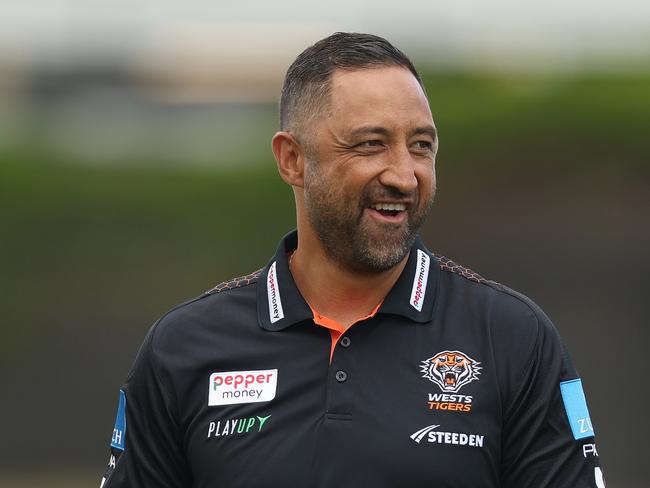 SYDNEY, AUSTRALIA - MARCH 07: Wests Tigers head coach Benji Marshall smiles before the round one NRL match between Wests Tigers and Newcastle Knights at Campbelltown Sports Stadium, on March 07, 2025, in Sydney, Australia. (Photo by Mark Metcalfe/Getty Images)