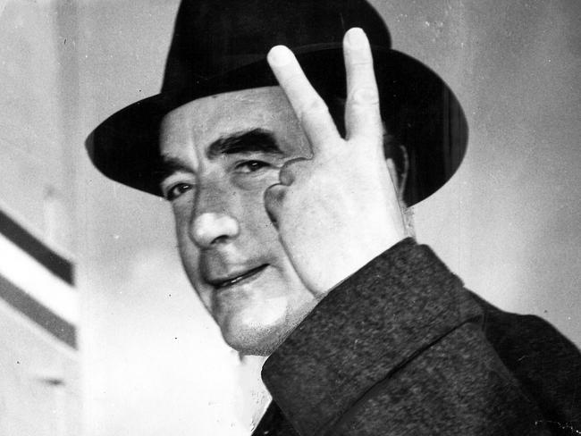 1951. The Prime Minister (Mr Menzies) demonstrates his confidence in the election result with a V for Victory sign as he boarded the plane at Essendon yesterday for Perth.[Sun 16/4/1951]Robert Menzies.