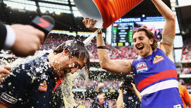 Luke Beveridge cops a Gatorade shower after the Dogs’ inspiring premiership win. Picture: Getty Images