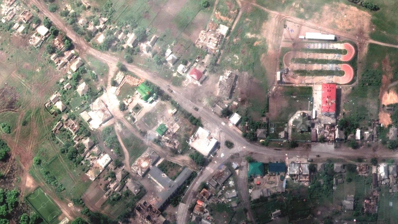 A satellite image released by Maxar Technologies on May 27 shows damaged buildings and a tank on the road in Lyman, Ukraine after a Russian attack.