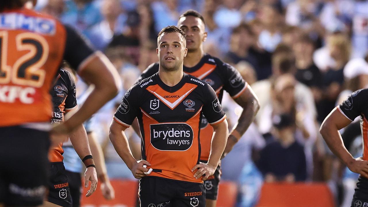 SYDNEY, AUSTRALIA - APRIL 10: Luke Brooks of the Tigers and his teammates look dejected after a try during the round five NRL match between the Cronulla Sharks and the Wests Tigers at PointsBet Stadium, on April 10, 2022, in Sydney, Australia. (Photo by Mark Kolbe/Getty Images)