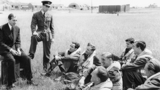 Air Vice Marshal Don Bennett looks on as his men are briefed by newly-appointed British minister. Credit: Australian War Memorial