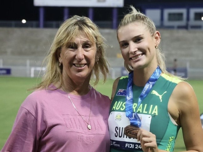 Emelia Surch with coach and 1984 Olympic Gold winner Glynis Nunn.