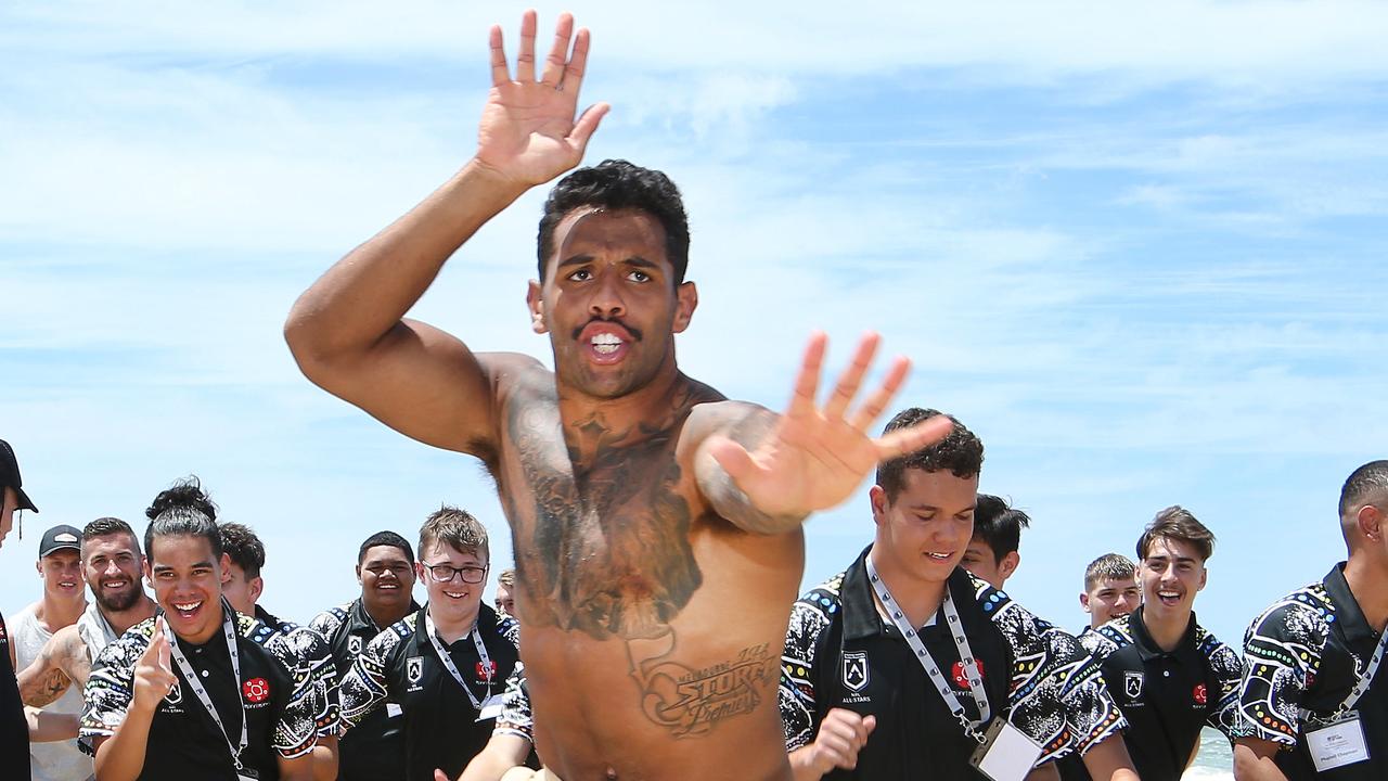 Josh Addo-Carr helps Youth Summit members find a buried clue then leads them on a merry dance during All Stars camp on the Gold Coast. Picture Glenn Hampson