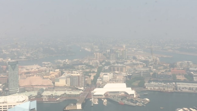 RAW: View from above shows Sydney CBD blanketed in smoke | Herald Sun