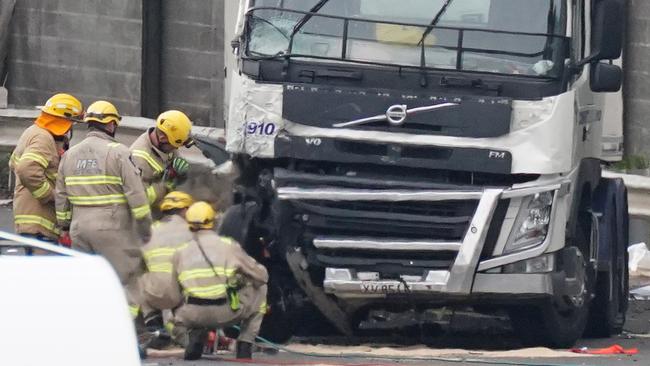 Rescue workers at the scene where Singh’s truck ploughed into four officers as they stood on the side of the Eastern Freeway.