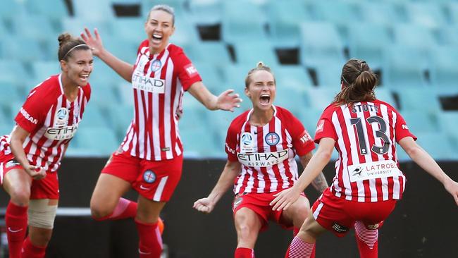 Fishlock celebrates after chipping the Sydney FC keeper.