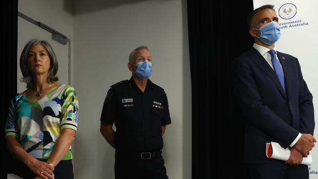 Masks will now go in most public locations: Prof Spurrier holds her mask alongside Mr Stevens and Mr Malinauskas. Picture: NCA NewsWire / Kelly Barnes