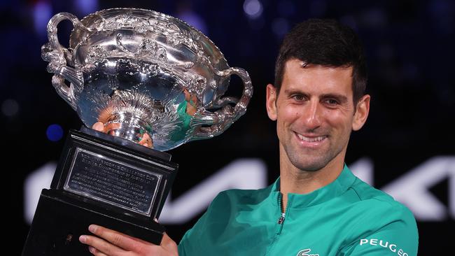 Novak Djokovic holds aloft the winner’s trophy after his 2021 Australian Open men’s singles final victory over Daniil Medvedev. Picture: Michael Klein