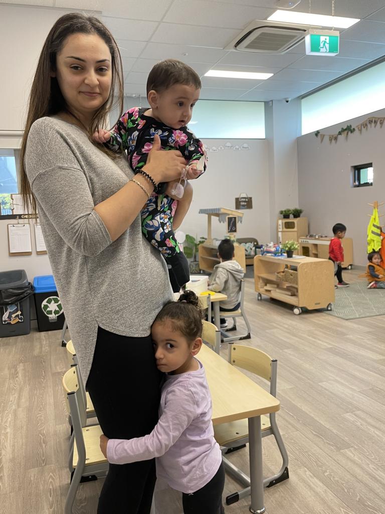 Mum Nora Safadi at the Young Academics Guildford childcare centre where she sends her daughter Lujayne, who turns three in April. She is holding her other daughter, Kaadira.