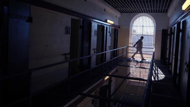 Tour guide Peter Brown inspects the upper levels of Wing 6 for any unusual activity at the Old Parramatta Gaol in North Parramatta. Picture: AAP IMAGE / Angelo Velardo