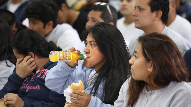 Guatemalan immigrants deported from the United States wait for processing after arriving on an ICE deportation flight. Picture: Getty Images