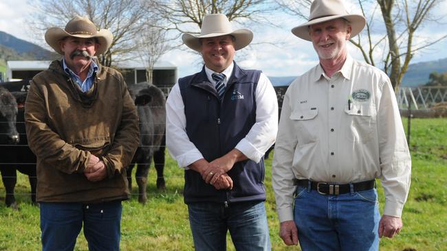 Stud stock agent and auctioneer Michael Glasser, centre, pictured with Greg White and Michael Gadd at a bull sale at The Glen.