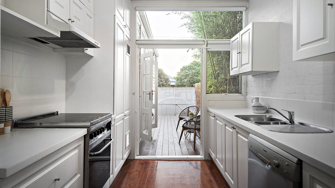The kitchen leads out to the decked area outside.