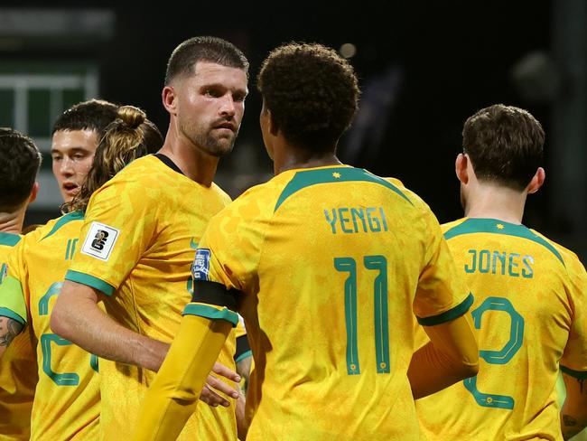 PERTH, AUSTRALIA - JUNE 11: Kusini Yengi of the Socceroos celebrates with team mates after scoring a goal during the Second Round FIFA World Cup 2026 Qualifier match between Australia Socceroos and Palestine at HBF Park on June 11, 2024 in Perth, Australia. (Photo by Will Russell/Getty Images)